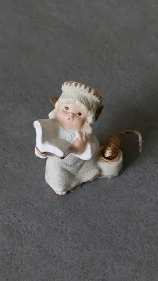 Angelo con candela decorativo