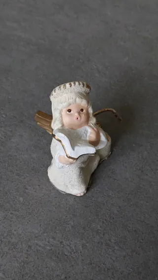 Angelo con candela decorativo