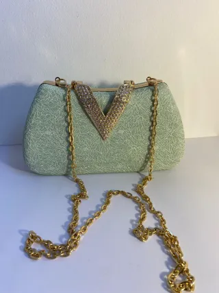 Bolso de fiesta verde y dorado