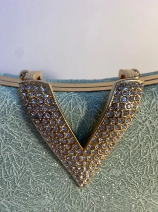 Bolso de fiesta verde y dorado