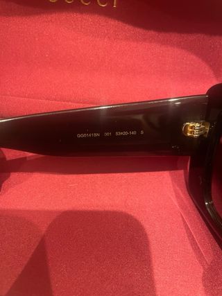 Occhiali da sole Gucci neri e oro