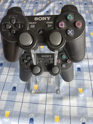 2 Mandos PS3 Sony Nuevos más soporte para mandos