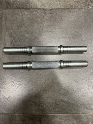 Barra, manubri e dischi di metallo per palestra