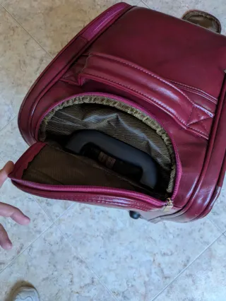 Maleta de viaje con ruedas color burdeos