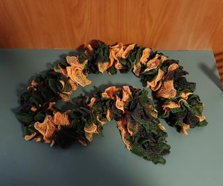 Bufanda de punto verde y naranja