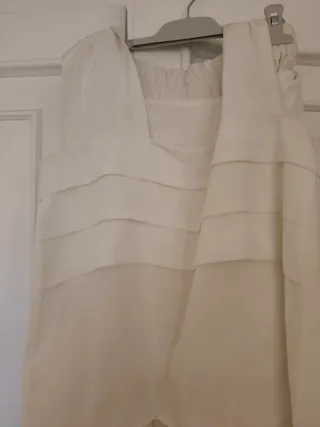 Conjunto blusa y falda plisada