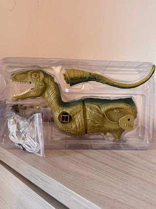 Dinosauro interattivo con spruzzo e luci