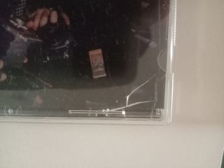 Poster autografato e cd di Robbie Williams