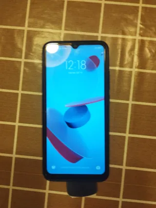 Xiaomi Redmi 9 NFC con cargador y funda