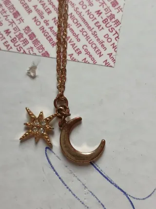 Collana con stella e luna dorata