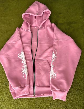 Sudadera rosa con capucha y ribete de pelo