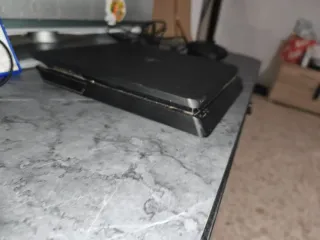 PS4 Slim 850GB + TV + Mando Nacon