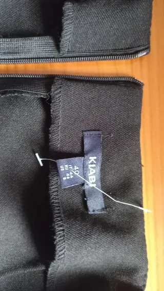 Short efeco falda corta negra con botones dorados