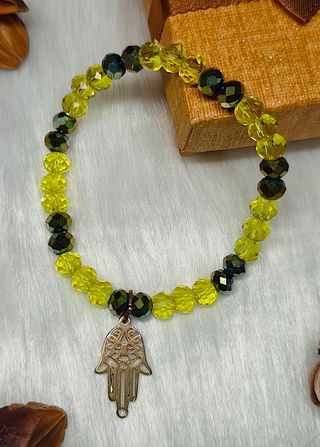 Pulsera cristal verde con mano de Fátima dorada