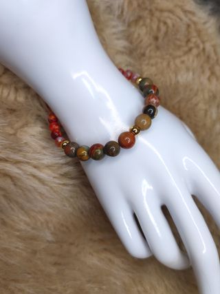 Pulsera ágata tierra con cuentas doradas y borla