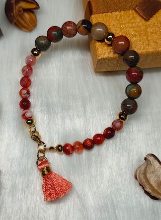 Pulsera ágata tierra con cuentas doradas y borla