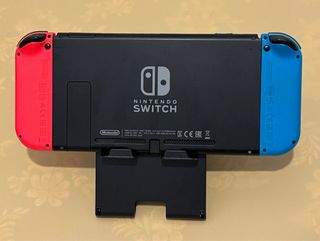 Nintendo Switch + controller Mario, accessori, microSD