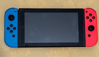 Nintendo Switch + controller Mario, accessori, microSD