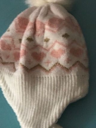 Berretto invernale con pompon e paraorecchie