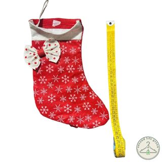 OE1.1) Calza natalizia rossa con fiocco decorativo