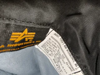 Chaqueta Alpha Industries MA1 Negra Naranja