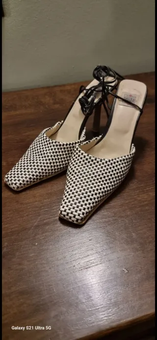 Pantaloni a quadri grigi e bianchi