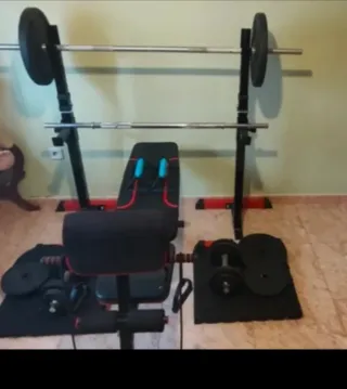 Banco de pesas con barra y discos