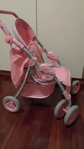Carrozzina per bambola rosa
