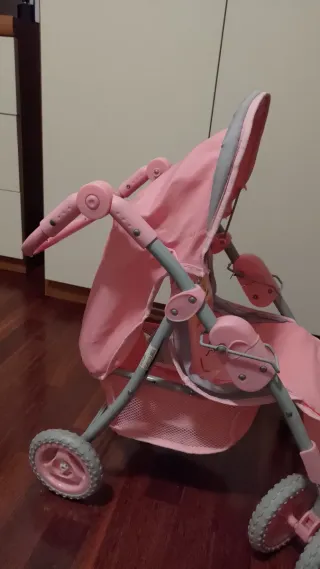 Carrozzina per bambola rosa