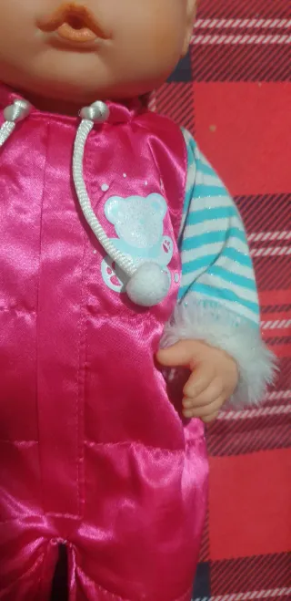 Bambola Nenuco con tutina rosa e cappellino