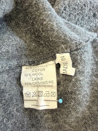 Jersey gris con estrella de lentejuelas