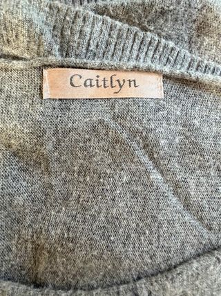 Jersey gris con estrella de lentejuelas