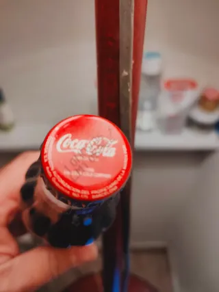 Bottiglia Coca-Cola piena
