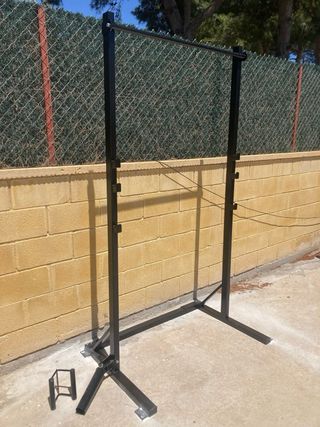 Attrezzatura per palestra a casa con rack, landmine, supporto per impugnature e dischi