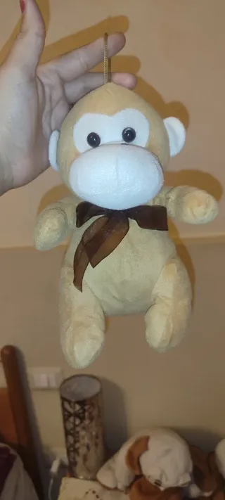 Peluche scimmia con fiocco marrone