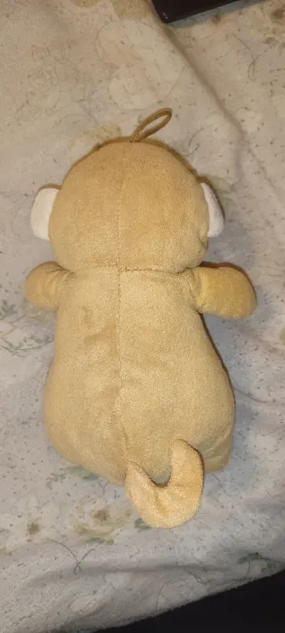 Peluche scimmia con fiocco marrone