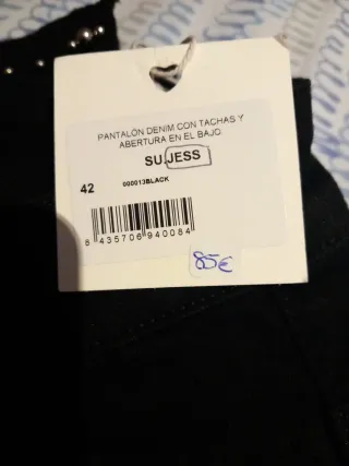 Pantalones campana negros con tachuelas