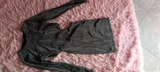 Vestito glitterato con scollatura sui fianchi