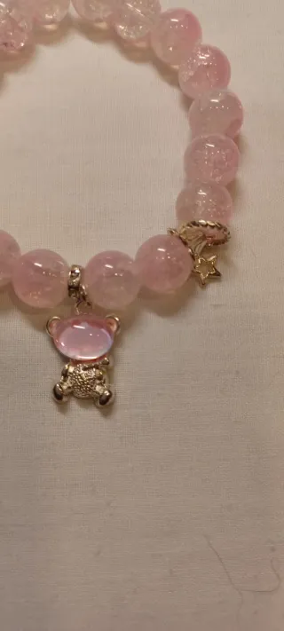 Bracciale con perle rosa e ciondoli in zama