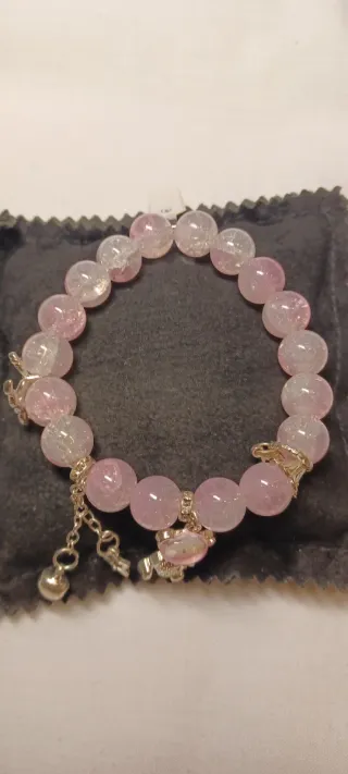 Bracciale con perle rosa e ciondoli in zama