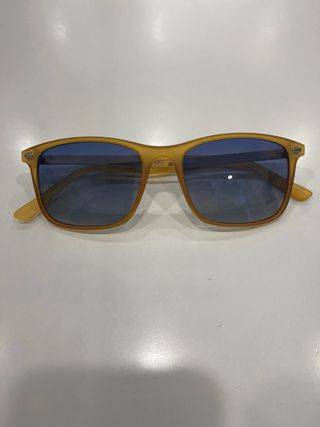 Occhiali da sole gialli con lenti blu