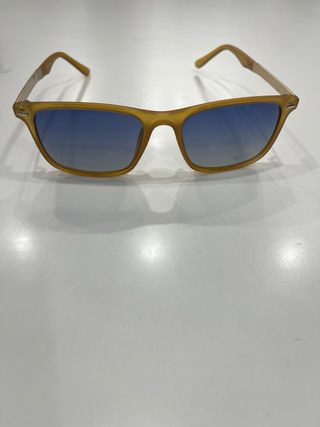 Occhiali da sole gialli con lenti blu
