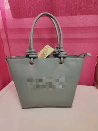 Bolso gris con nudos