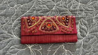 Bolso fiesta pedrería naranja y lentejuelas