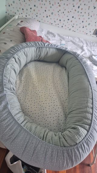 cojín reductor para bebé-cuna