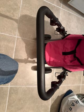 Carro de muñecas rosa y morado