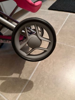 Carro de muñecas rosa y morado