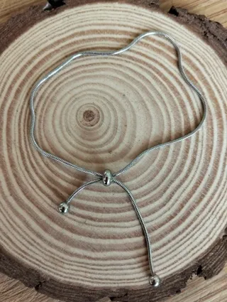 Pulsera acero ajustable.