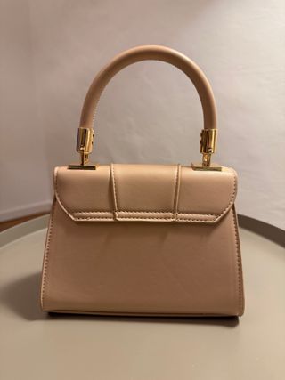 Pochette beige con manico dorato