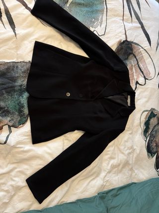 Pantalones negros y americanas